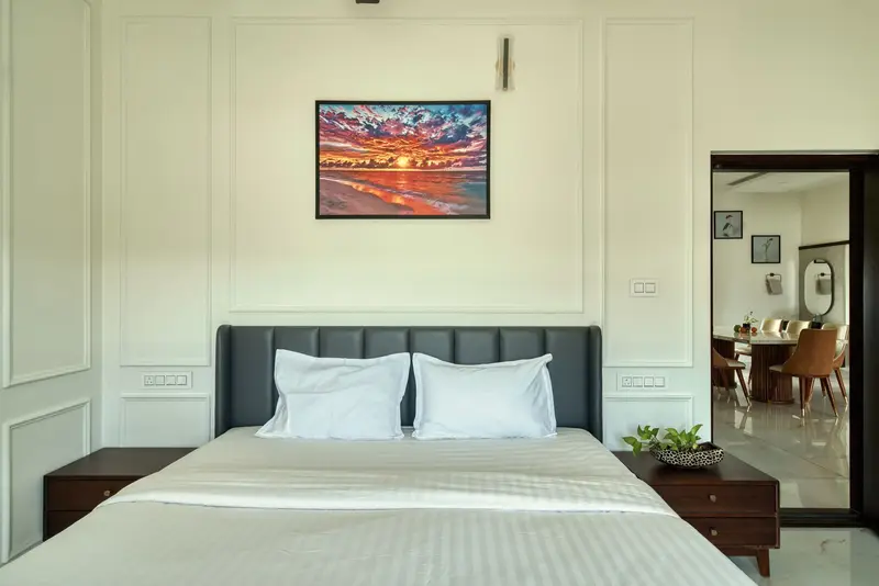 King bed with a grey headboard and wardrobe