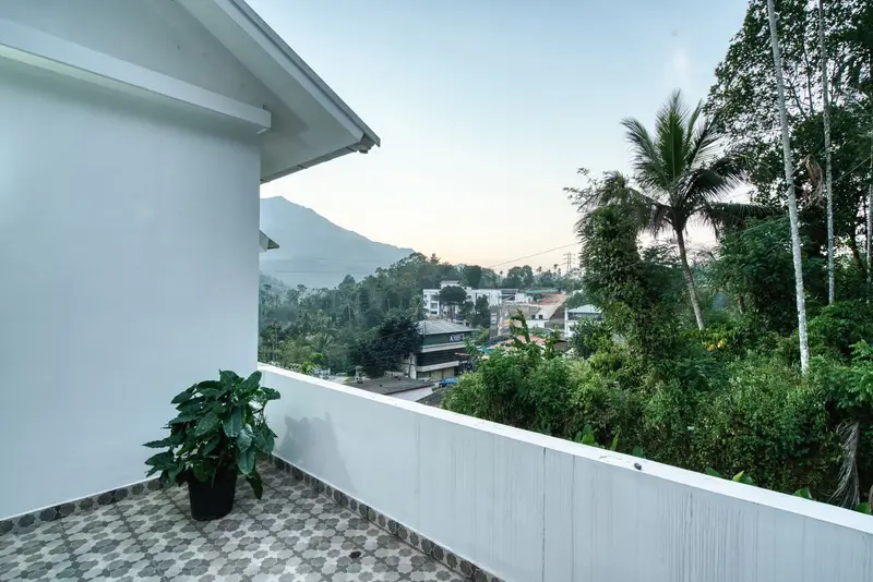 Terrace looking over trees to the hills